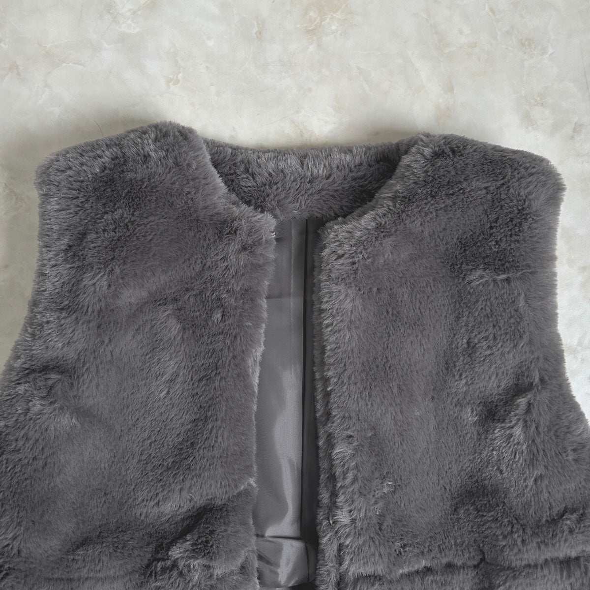 ラビット風ペプラムファーベスト