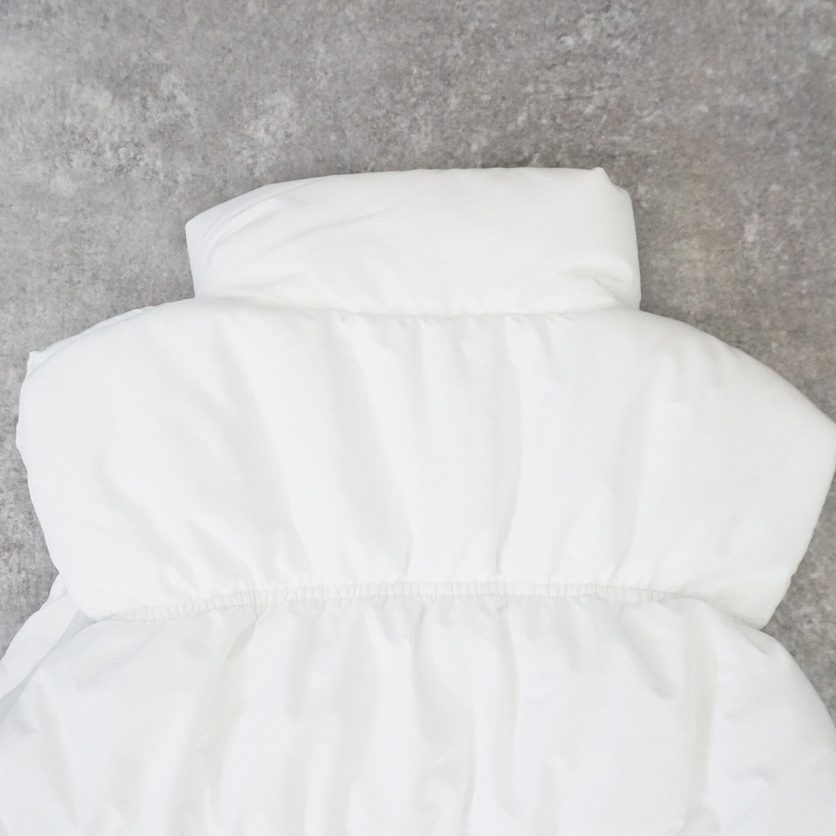 裾ドロストショート中綿ベスト